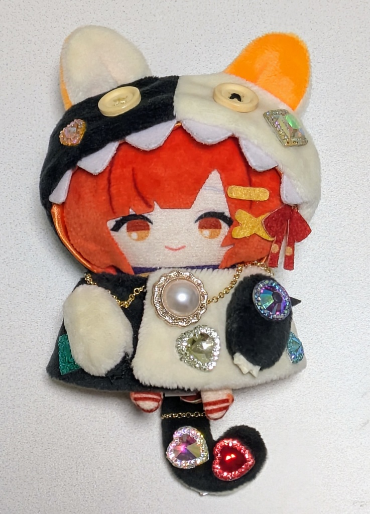 ギラギラなネコチャンフード付きポンチョ