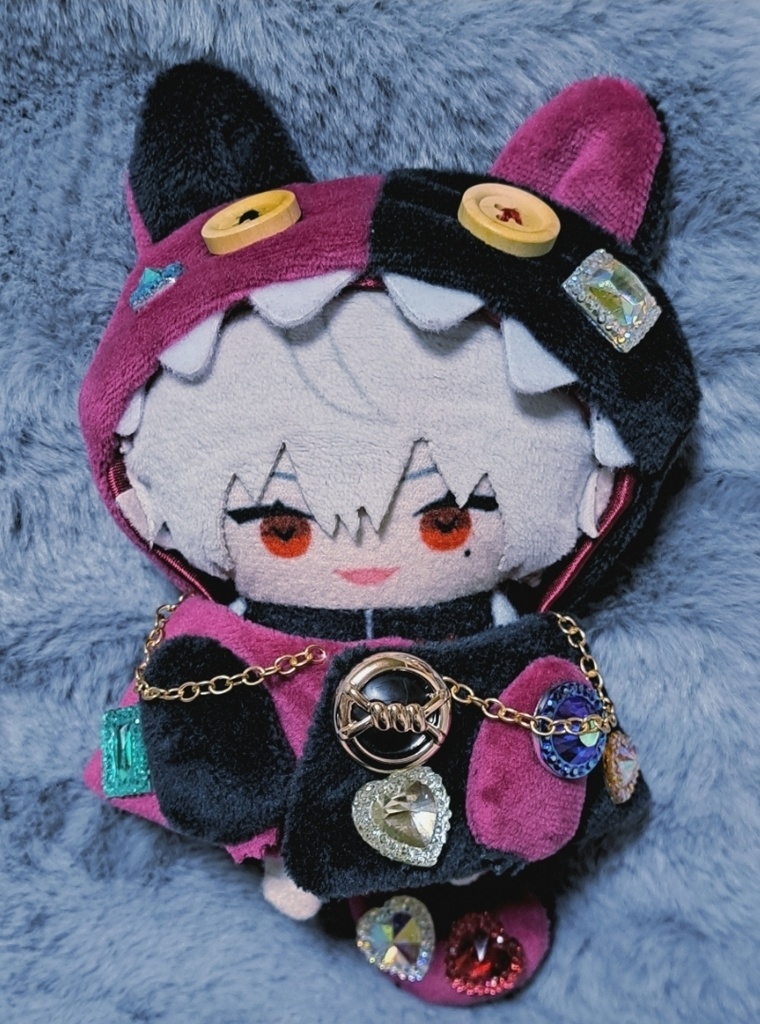 ギラギラなネコチャンフード付きポンチョ