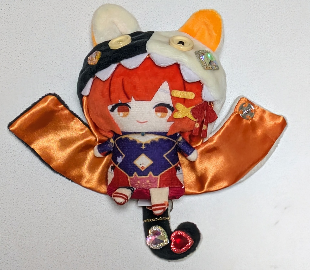 ギラギラなネコチャンフード付きポンチョ