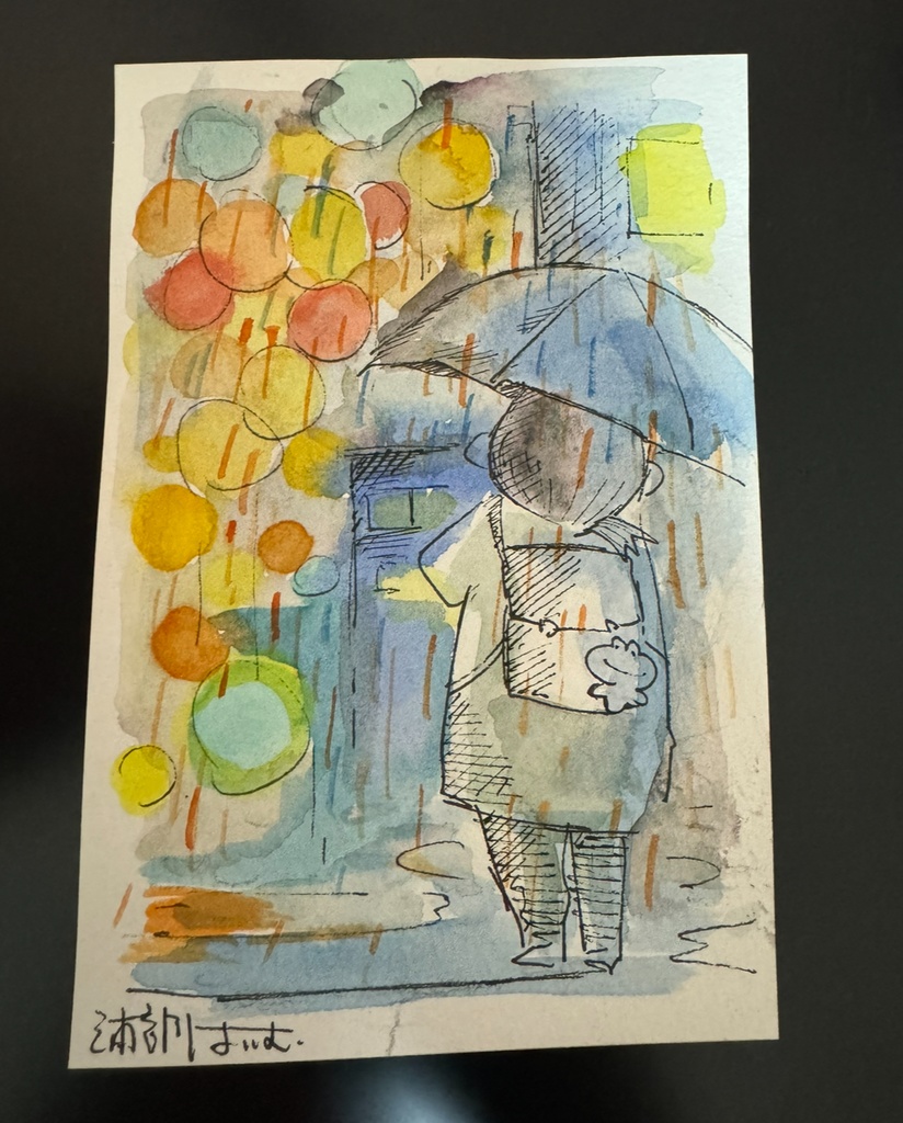 夜の雨ライトに照らされる