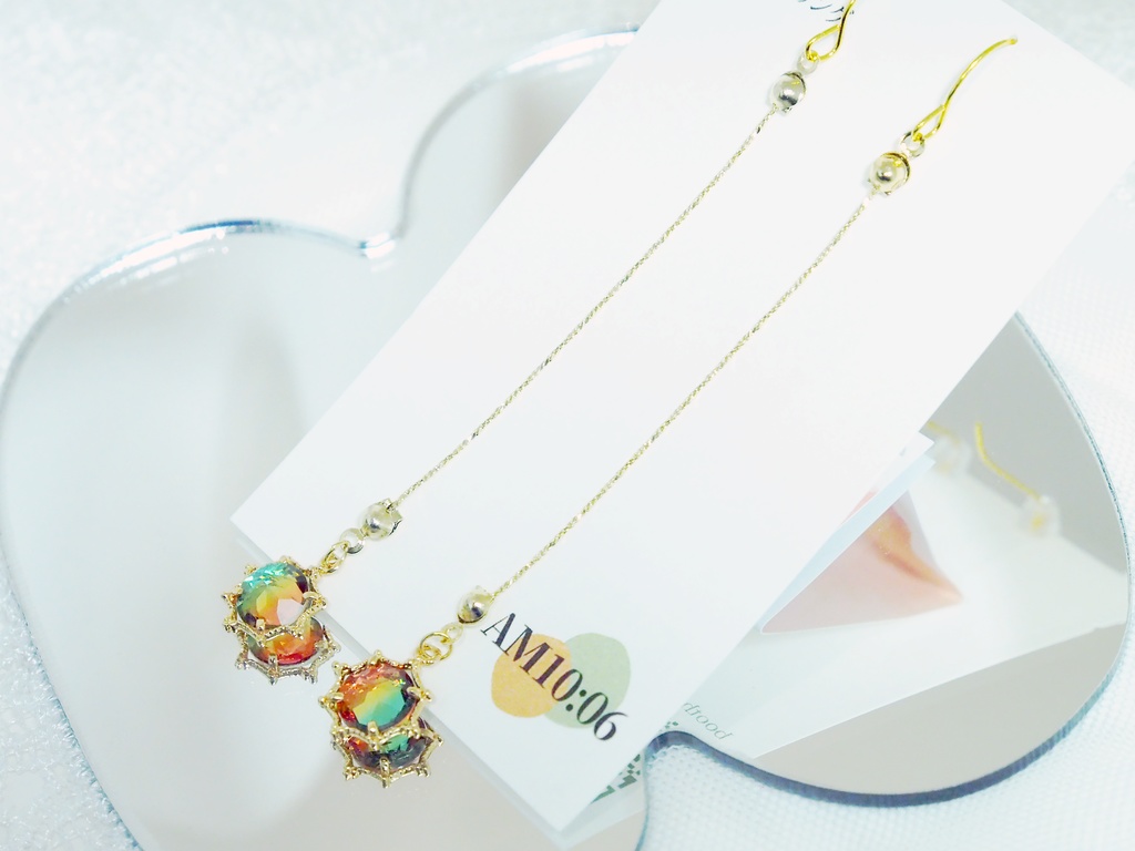 オレンジと緑のきらきらパーツのピアス・イヤリング