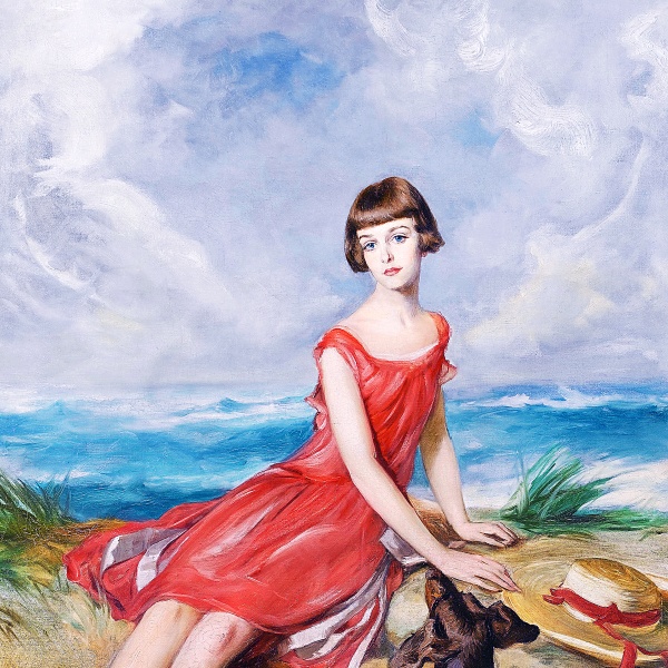 海辺で犬と一緒の赤いドレスの少女