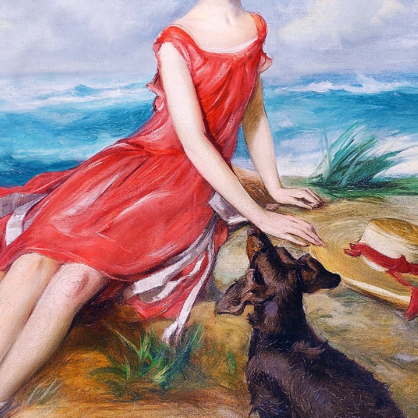 海辺で犬と一緒の赤いドレスの少女