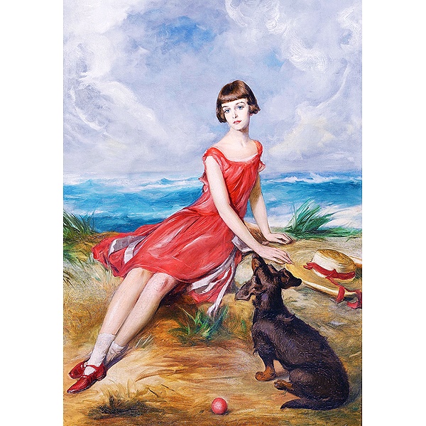 海辺で犬と一緒の赤いドレスの少女