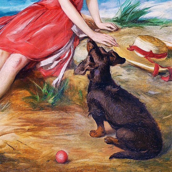 海辺で犬と一緒の赤いドレスの少女