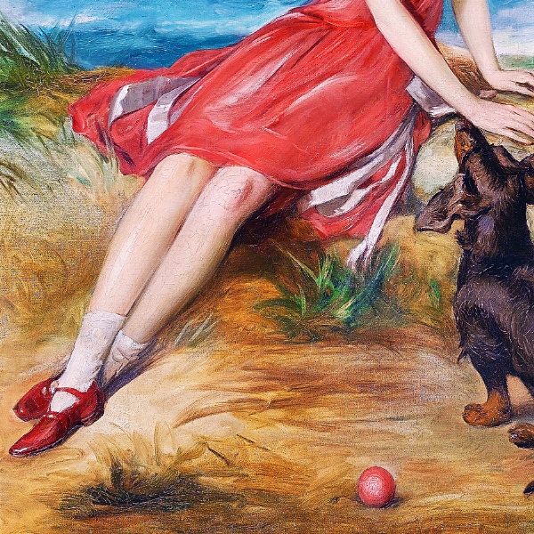 海辺で犬と一緒の赤いドレスの少女