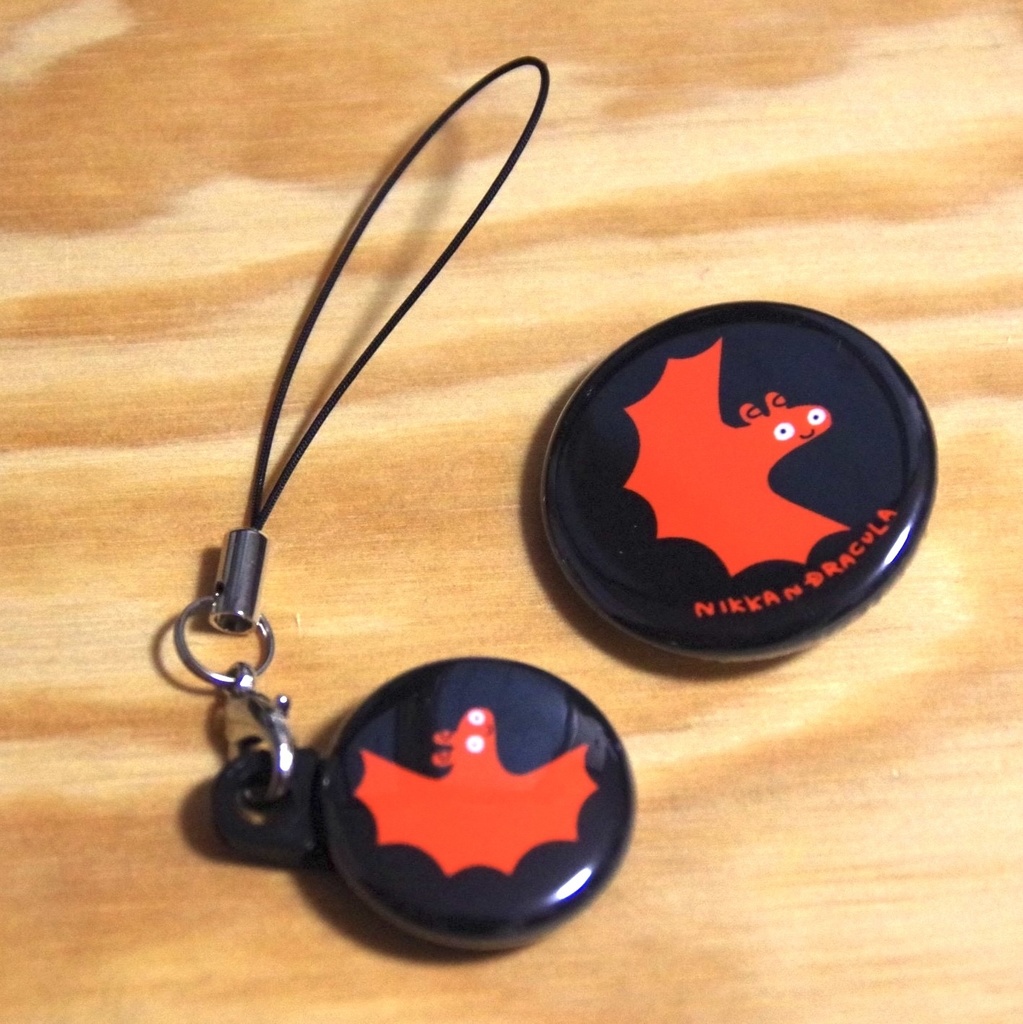 オレンジのコウモリの缶グッズ