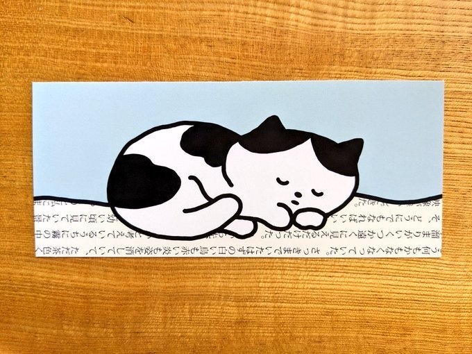本の毛布で眠るしおり(猫）