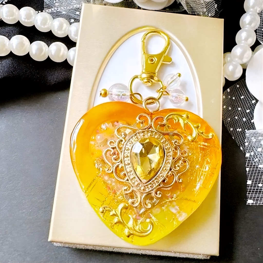 透きとおるオレンジイエロー 女神の舞踏会– Bal de Déesse – オイル入りシェイカー シャカシャカキーホルダー