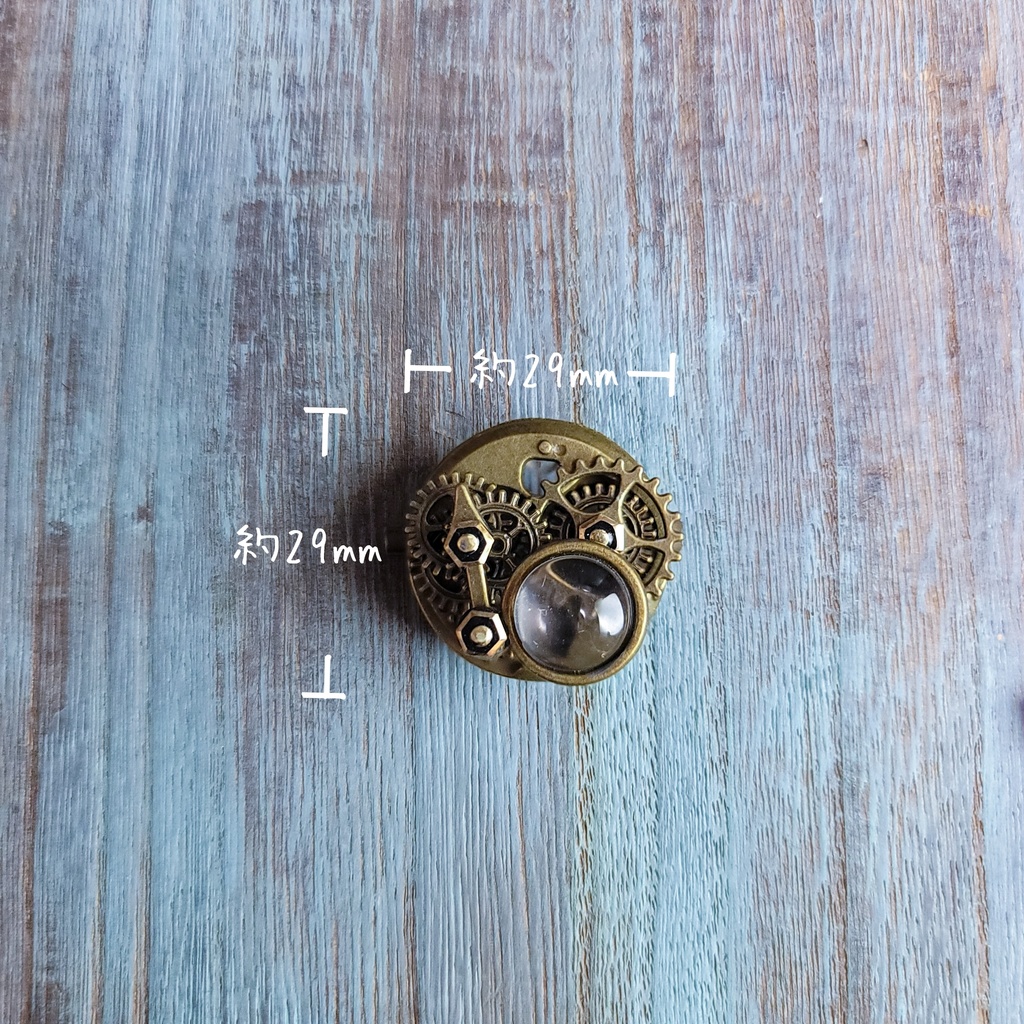 ルーペと回転する歯車(ブローチ)