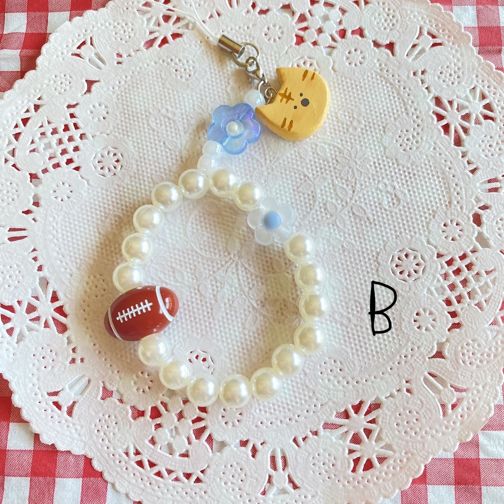 ねことラグビーのストラップ🏉