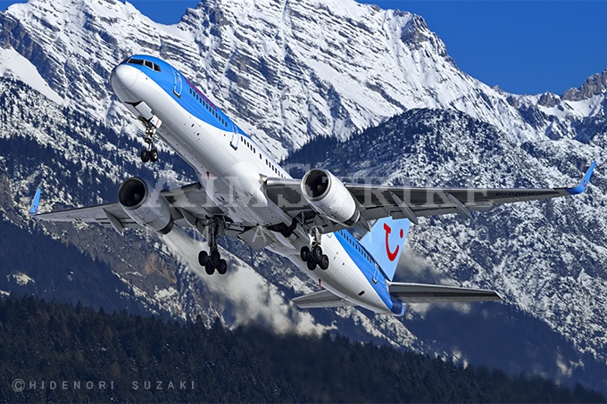 Thomson 757 takes off base of snowy Tirol Alpen
