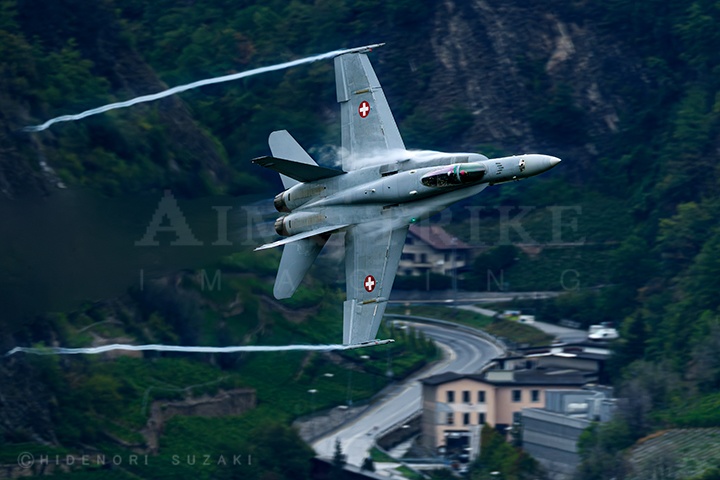 F/A-18C enter 360° slanted turn while avoid mountain