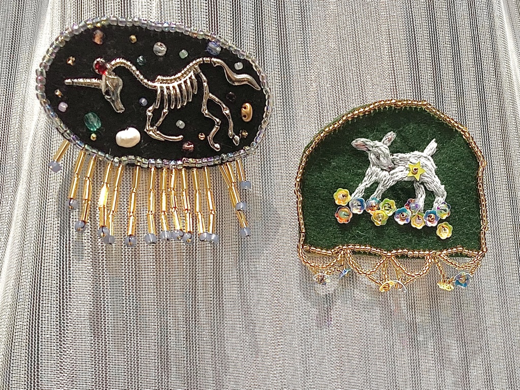 Unicorn fossil brooch