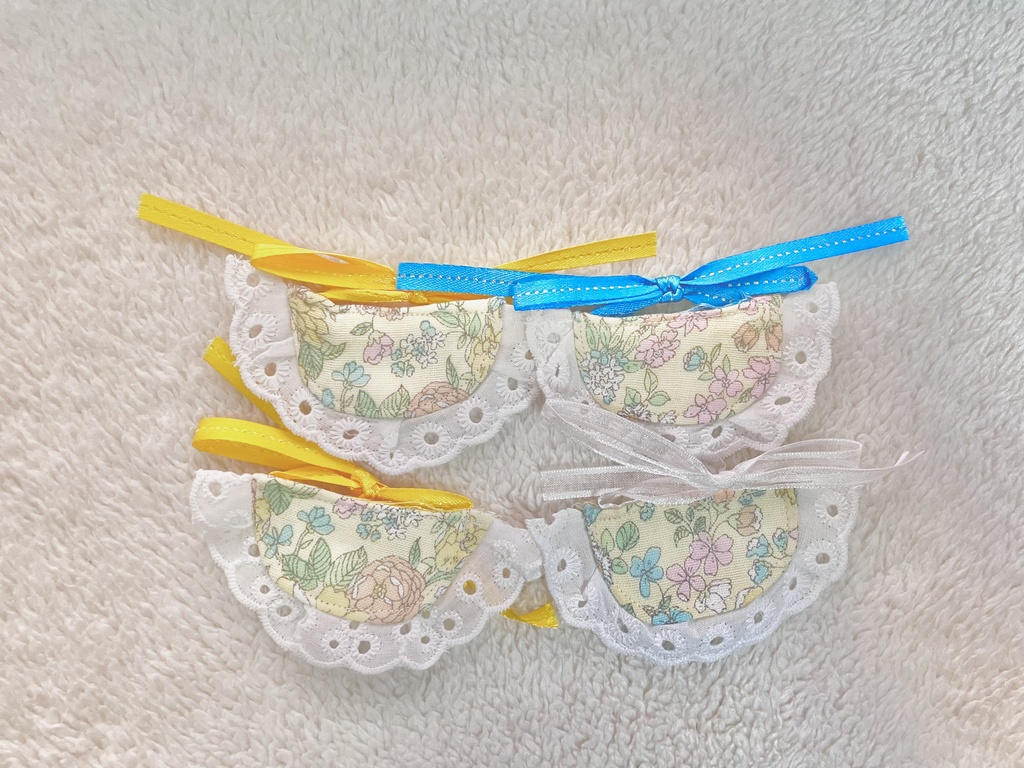 ぬいぐるみのエプロン 黄色お花柄