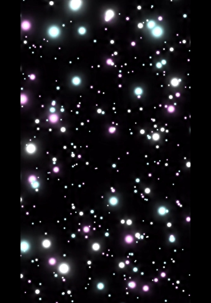 カラフルな光の粒子が揺らぎながら舞う背景
