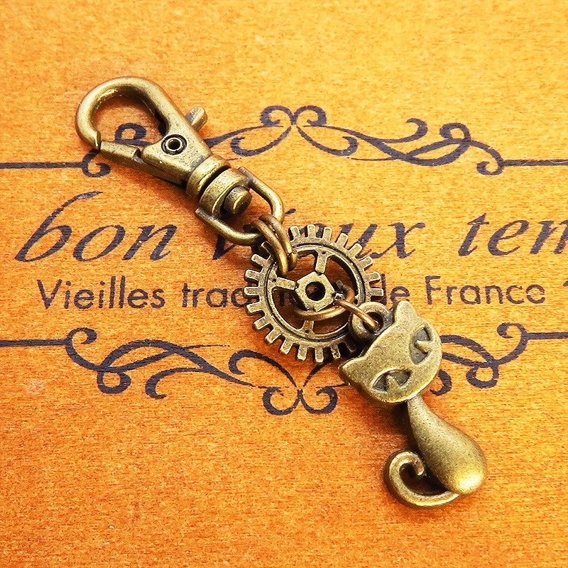アンティークゴールド 猫と歯車のシンプルで可愛いファスナーチャーム キーホルダー バッグチャーム 金具変更可