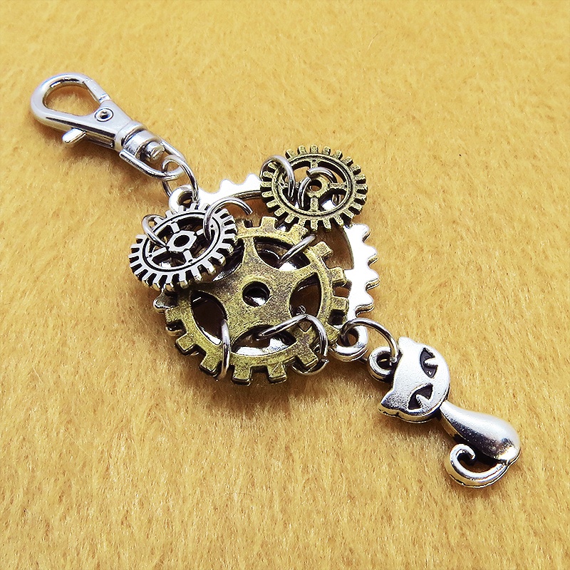 スチームパンク風 猫と複数の歯車を組み合わせたキーホルダー ファスナーチャーム バッグチャーム