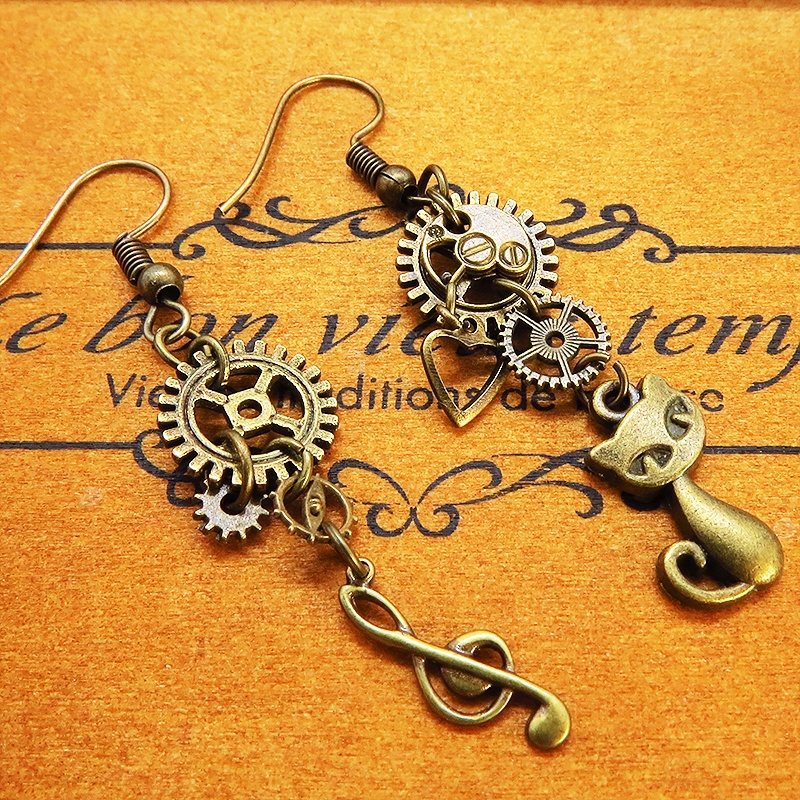 アンティーク調金古美色の猫と音符と歯車・ギアのアシンメトリーピアス スチームパンク ファッション