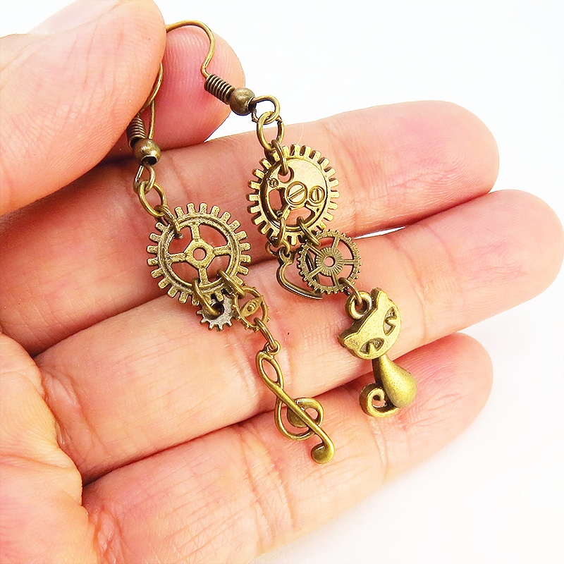 アンティーク調金古美色の猫と音符と歯車・ギアのアシンメトリーピアス スチームパンク ファッション