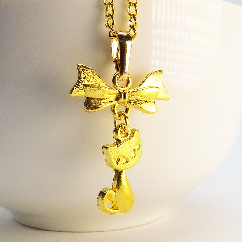 ゴールドカラーの猫とリボンのシンプルで可愛いネックレス 長さ変更可 SV925 18KGC変更可 アジャスター可