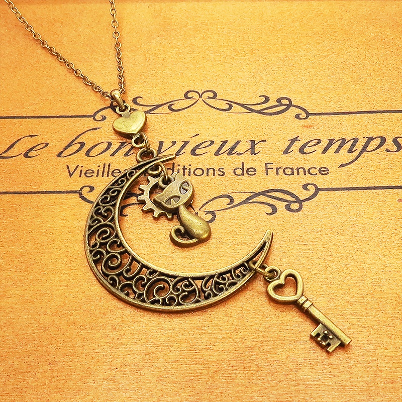 アンティークゴールド 猫とアラベスク調の透かし三日月を組合せたネックレス ハート 鍵 ムーン 大人可愛い アジャスター付