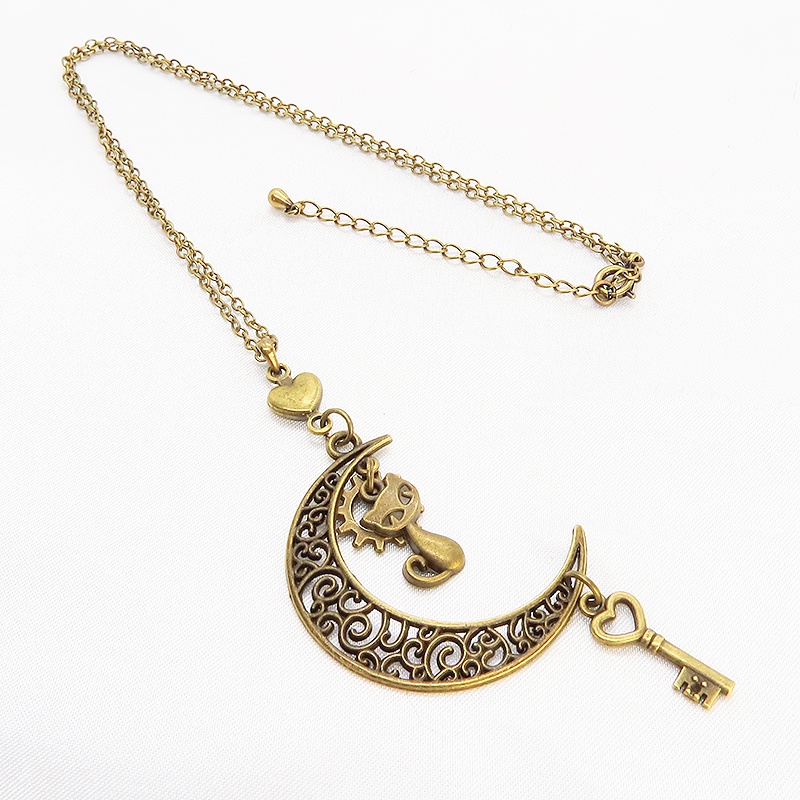 アンティークゴールド 猫とアラベスク調の透かし三日月を組合せたネックレス ハート 鍵 ムーン 大人可愛い アジャスター付