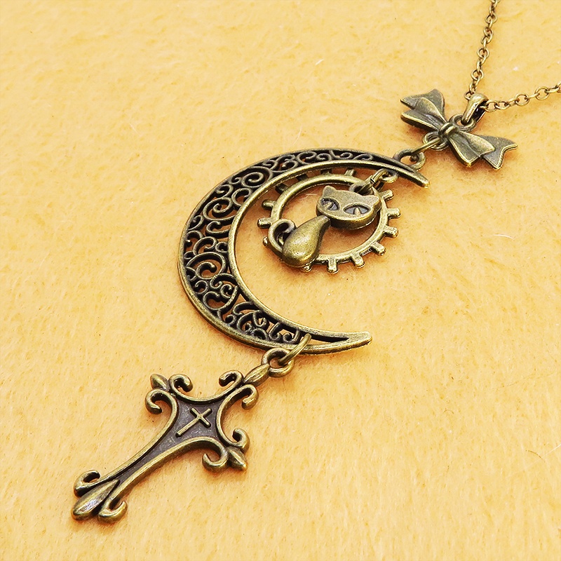 アンティークゴールド 猫とアラベスク調の透かし三日月のネックレス ロザリオ リボン ムーン アジャスター付 アジャスター付