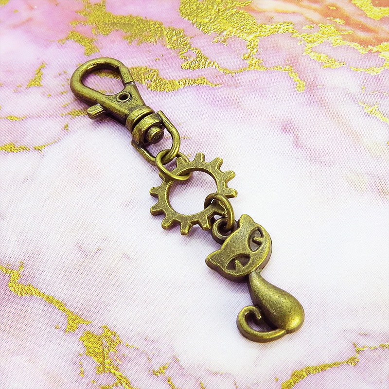 アンティークゴールド 猫と歯車のコンパクトなファスナーチャーム キーホルダー バッグチャーム スチームパンク風