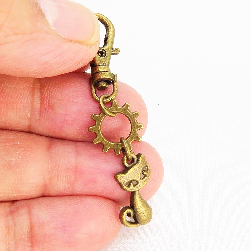 アンティークゴールド 猫と歯車のコンパクトなファスナーチャーム キーホルダー バッグチャーム スチームパンク風