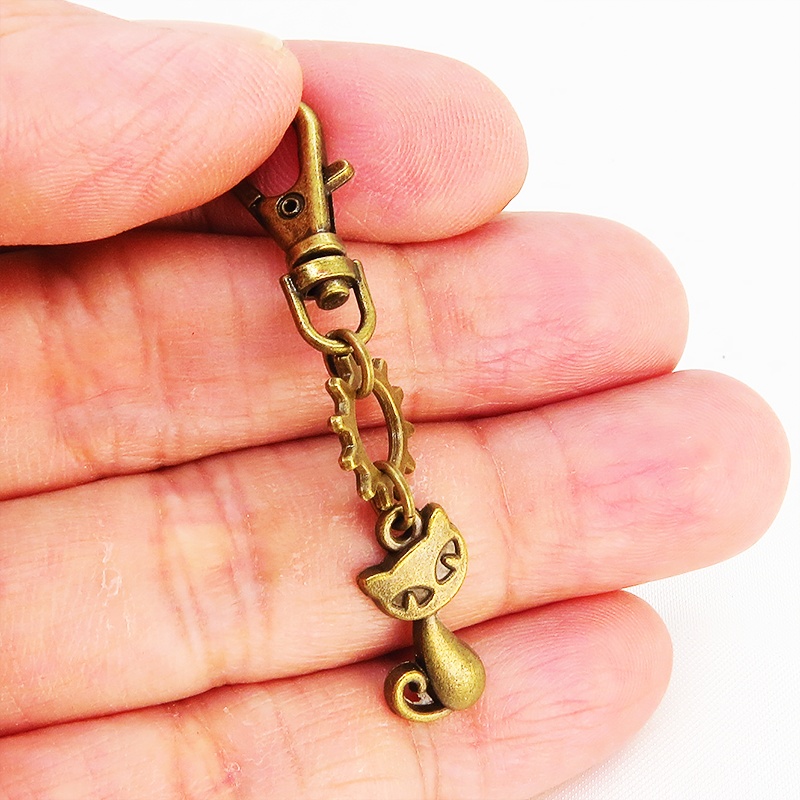 アンティークゴールド 猫と歯車のコンパクトなファスナーチャーム キーホルダー バッグチャーム スチームパンク風