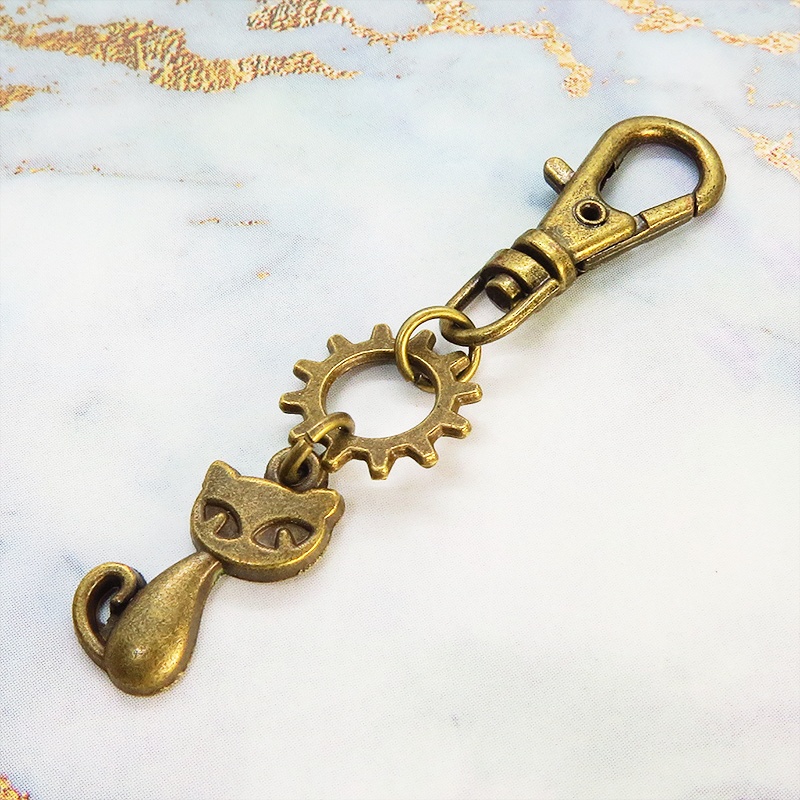 アンティークゴールド 猫と歯車のコンパクトなファスナーチャーム キーホルダー バッグチャーム スチームパンク風