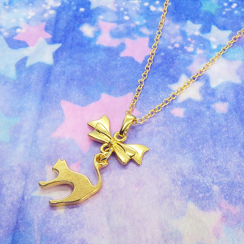 マットゴールド 跳ね猫とリボンのモチーフを組合せたコンパクトで大人可愛いネックレス 長さ変更可 アジャスター可