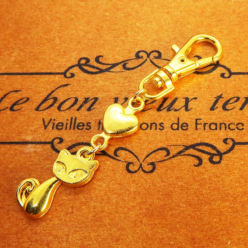 ゴールドカラーのかわいい猫のファスナーチャーム キーホルダー イエローゴールド
