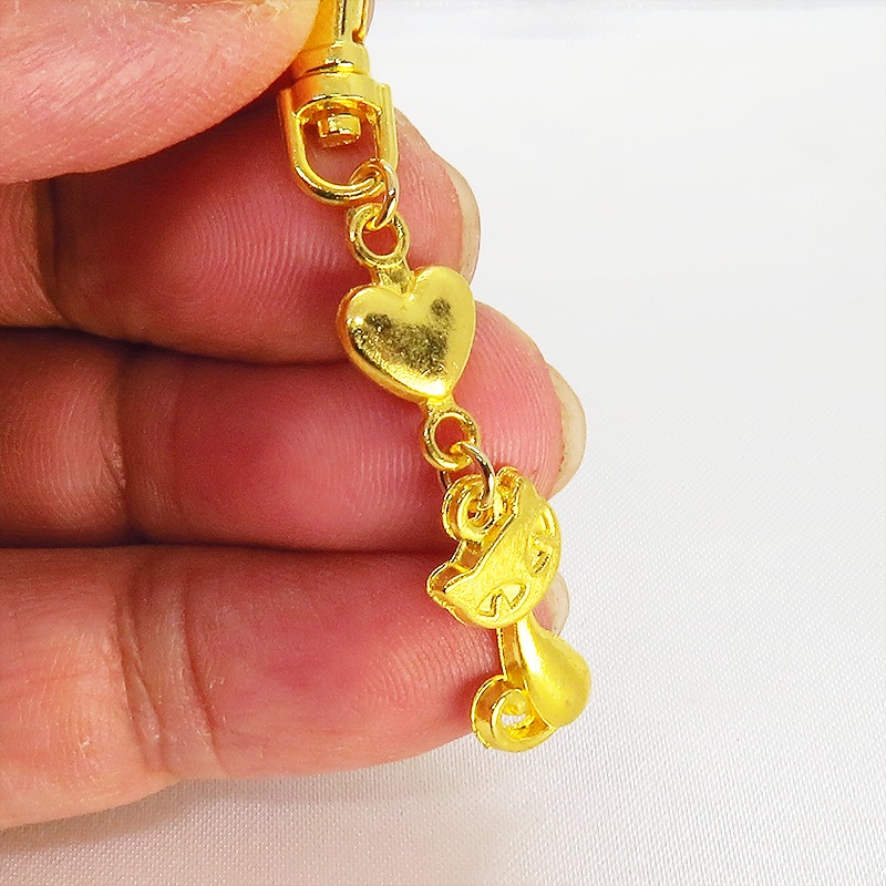 ゴールドカラーのかわいい猫のファスナーチャーム キーホルダー イエローゴールド