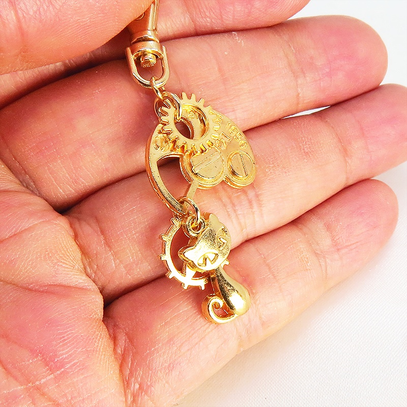 マットゴールドの猫と歯車・ギア ファスナーチャーム キーホルダー スチームパンク にゃお