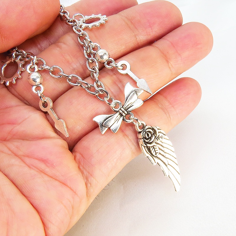 アンティークシルバー 翼と歯車のスチームパンク風ブレスレット リボン 時計の針 メンズ レディース