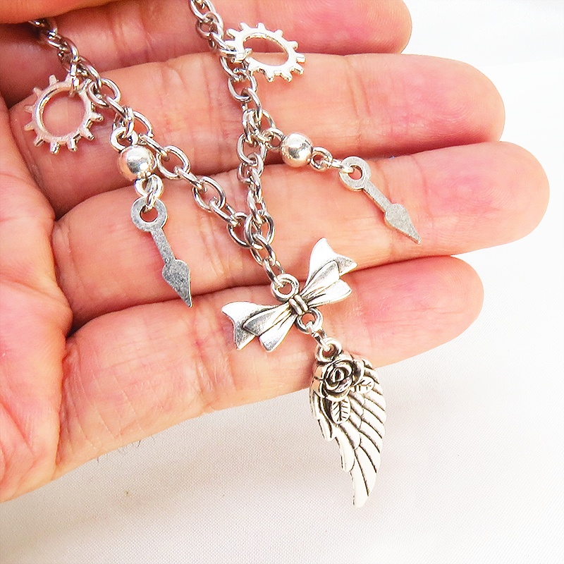 アンティークシルバー 翼と歯車のスチームパンク風ブレスレット リボン 時計の針 メンズ レディース