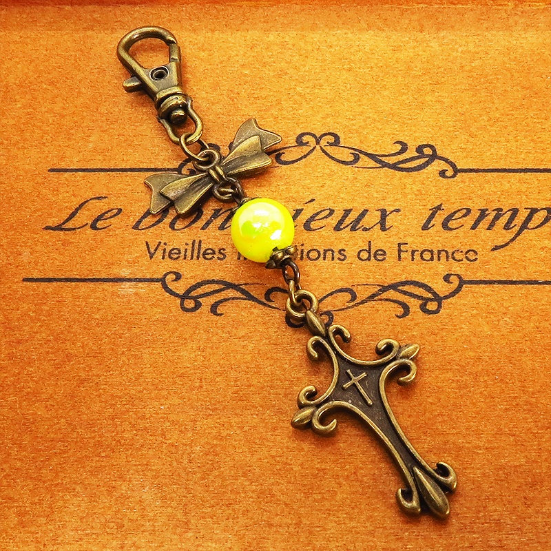 アンティークゴールド ロザリオとリボンの組み合わせにミックスイエロービーズキーホルダー ファスナーチャーム