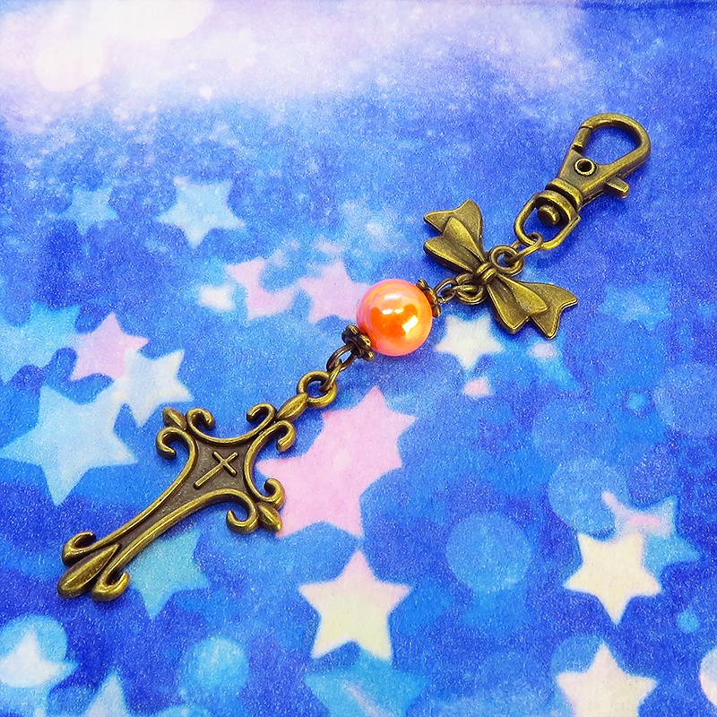 アンティークゴールド ロザリオとリボンの組み合わせにオレンジミックスビーズキーホルダー ファスナーチャーム