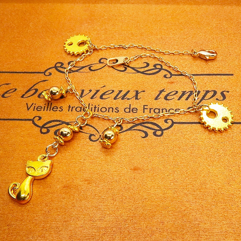 スチームパンク風 猫と歯車のブレスレット メタルビーズ イエローゴールド 繊細