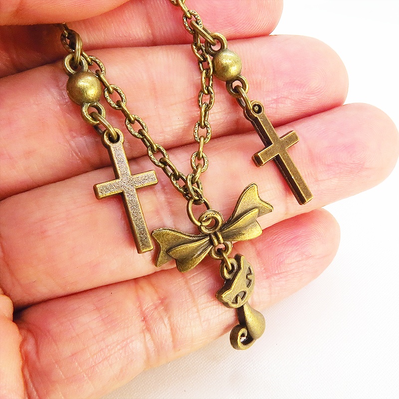 スチームパンク風 猫とロザリオのブレスレット アンティークカラー 歯車・ギア リボン