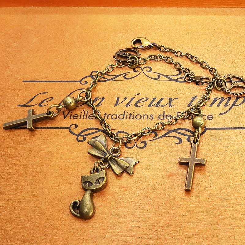 スチームパンク風 猫とロザリオのブレスレット アンティークカラー 歯車・ギア リボン