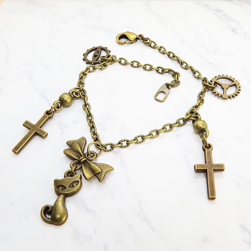 スチームパンク風 猫とロザリオのブレスレット アンティークカラー 歯車・ギア リボン