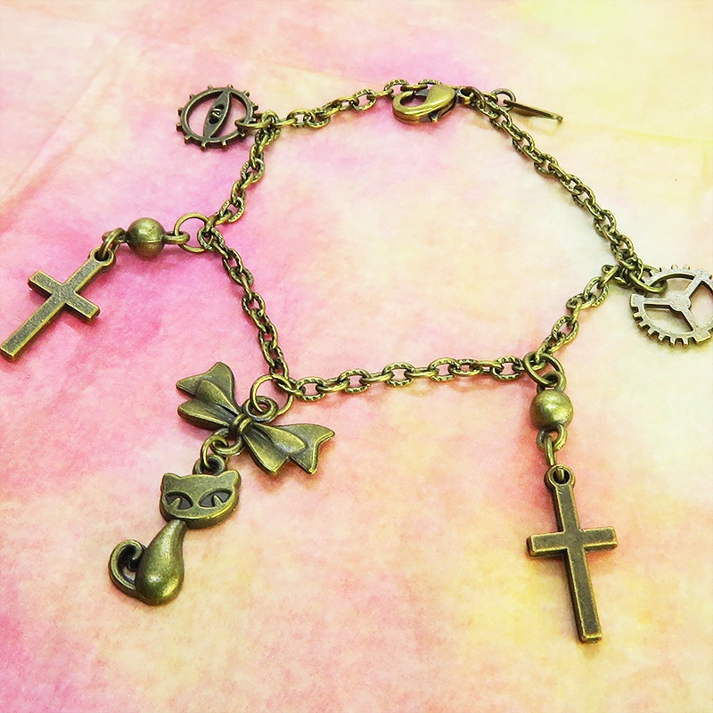 スチームパンク風 猫とロザリオのブレスレット アンティークカラー 歯車・ギア リボン