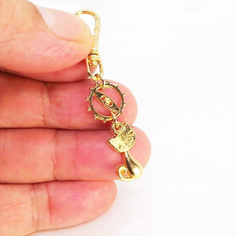 マットゴールドに輝く猫と歯車のシンプルに可愛いファスナーチャーム キーホルダー マスクチャーム