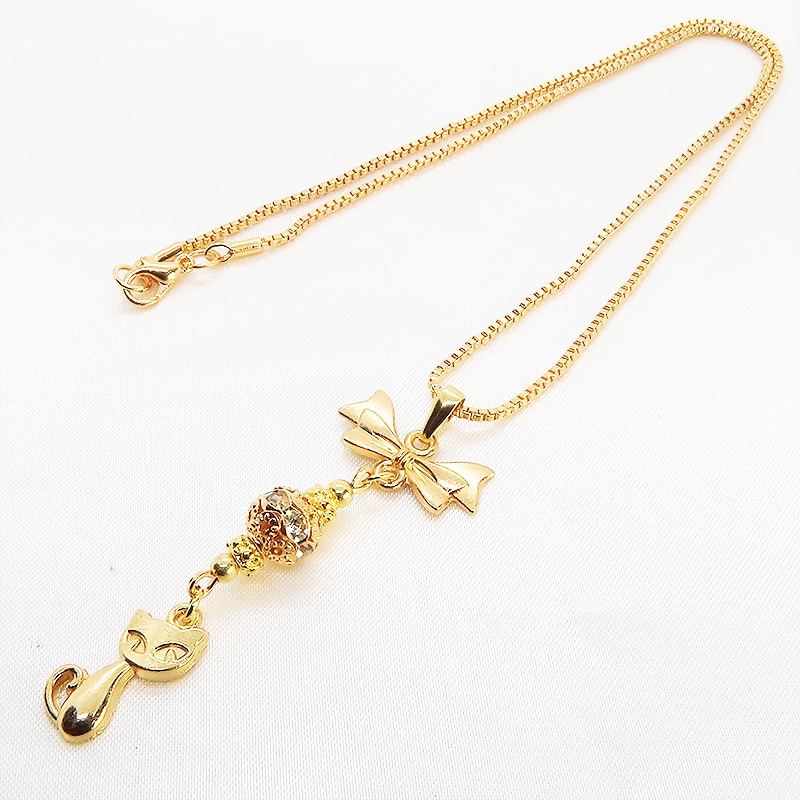 マットゴールド 猫とリボンのネックレス ガラス入りメタルビーズ ベネチアンチェーン アジャスター可