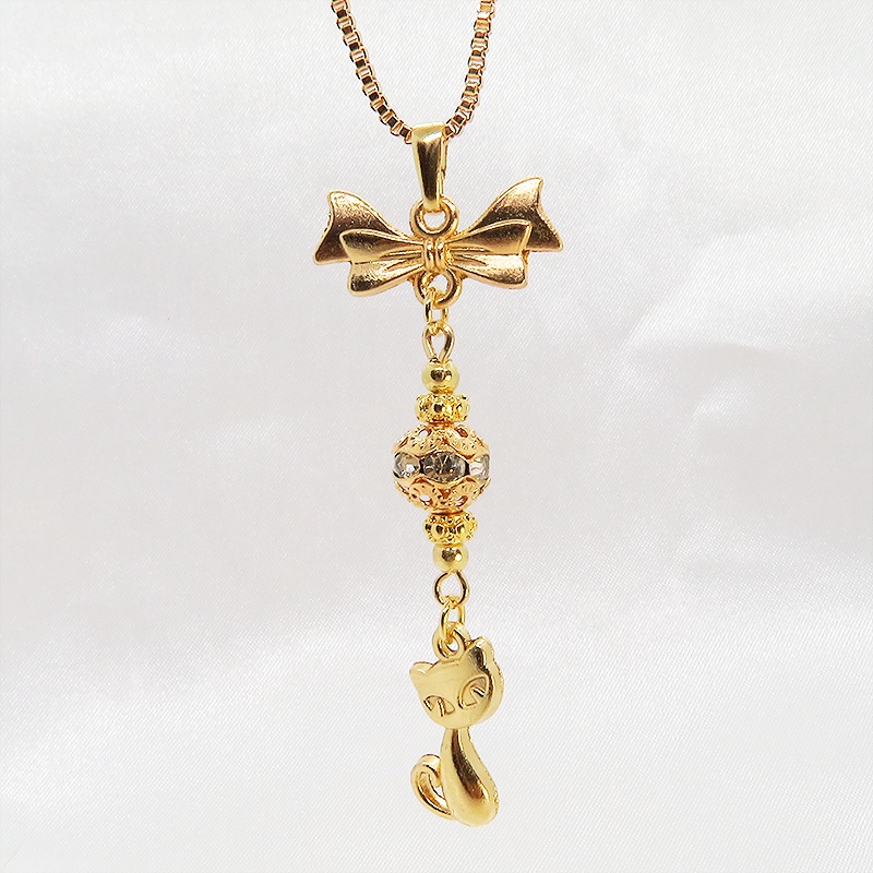 マットゴールド 猫とリボンのネックレス ガラス入りメタルビーズ ベネチアンチェーン アジャスター可