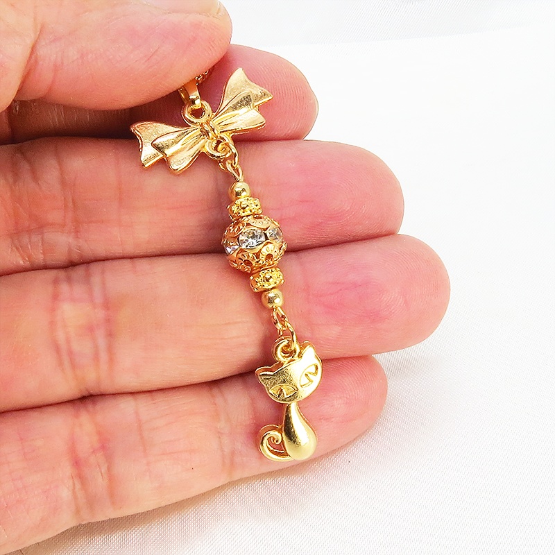 マットゴールド 猫とリボンのネックレス ガラス入りメタルビーズ ベネチアンチェーン アジャスター可