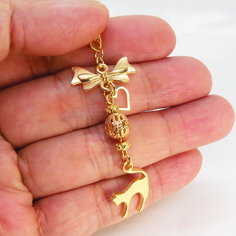 マットゴールド 跳ね猫とリボンネックレス メタルビーズ 長さ調整可 ステンレス可 アジャスター追加可